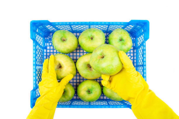 一盒苹果，戴着手套的手。图片下载