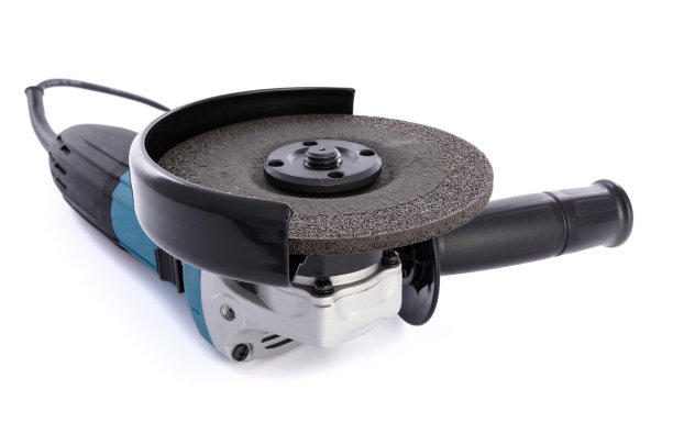 角磨床上的金属在一个白色的背景图片下载