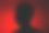 一个轮廓清晰的男性轮廓转向右边，背景是红色聚光灯和胸部后面明亮的区域。图片下载