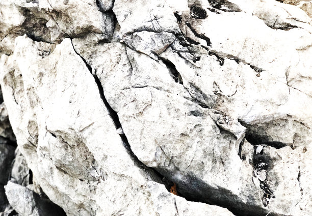 石质石或石灰石具有粗糙的表面，石质图案有纹理背景，用于建筑，部分山的形状。固体大理石块表面抽象，复古的风格概念。图片下载