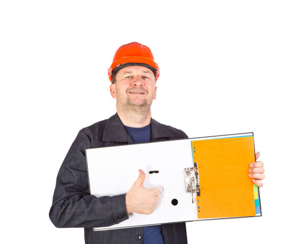 工人在安全帽与打开文件夹。图片下载