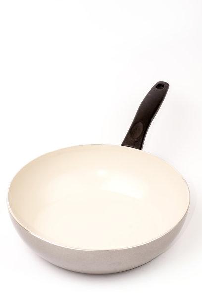 白色背景上的空煎锅图片下载