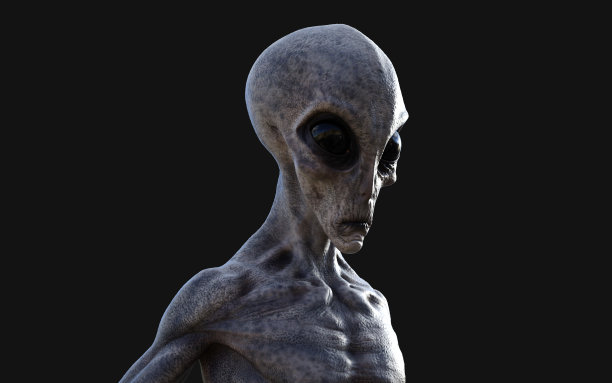一个灰色的外星人在黑暗的背景和剪切路径。图片下载