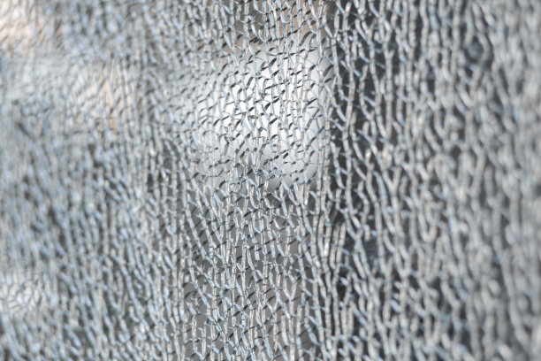 破碎的钢化玻璃。破碎的玻璃。图片下载