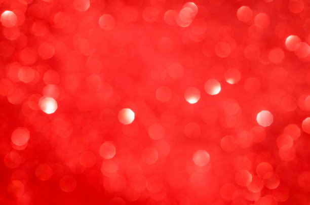 红色的散景。假日抽象背景与复制空间。图片下载