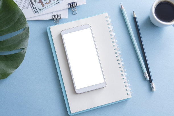 平铺的工作场所与智能手机模型。经营理念图片下载