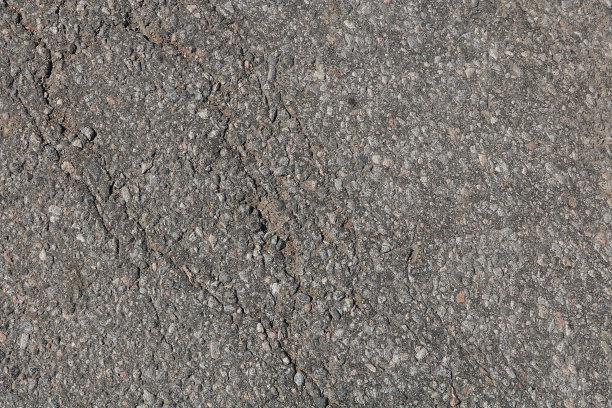 有裂缝的老石墙，自然的背景，石头的纹理，垃圾。用于装饰建筑和堤岸，为桌面和照片设计的一个美好的背景，主题拍摄的基础图片下载