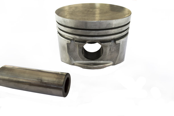 活塞和活塞销在桌子上。隔离图片下载
