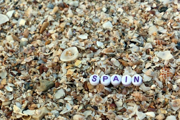 西班牙卵石沙纹理夏季海滩假日图像。炎热的太阳最好放松假期蜜月旅行旅游度假海岸线海景岛屿度假夫妇目标幸福背景墙纸横幅。图片下载