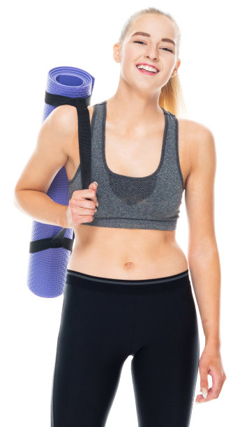 白种人少女准备瑜伽在白色背景穿着慢跑裤和使用运动垫图片下载