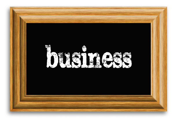 大黑板与文字业务在木框在光的背景图片下载