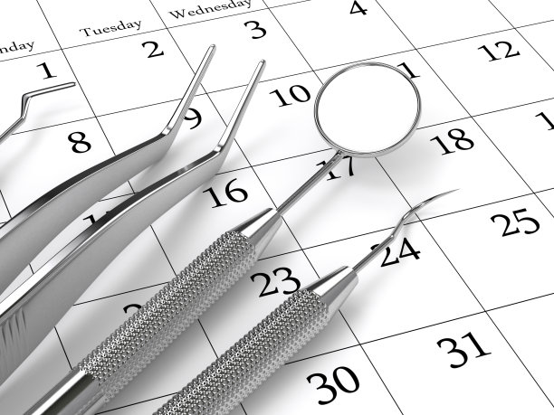 牙科诊断仪器躺在日历上的3d渲染图片下载
