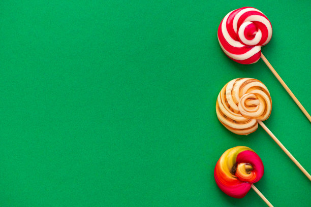 美味的糖果棒棒糖，不同颜色的绿色图片下载