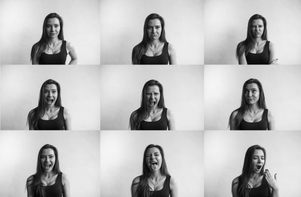 一套黑白照片的年轻女子的肖像与不同的情绪。年轻美丽可爱的女孩表现出不同的情绪。大笑，微笑，愤怒，怀疑，恐惧，惊讶。图片下载