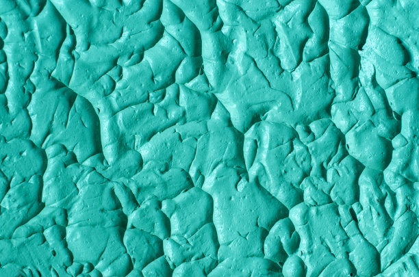 绿色化妆粘土(海带面膜、面霜、螺旋藻体贴)质地近距离，选择性聚焦。抽象的背景与画笔笔触。图片下载