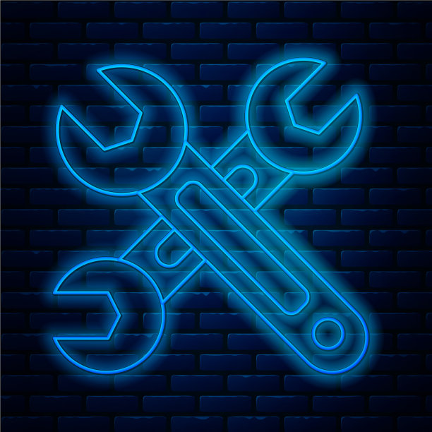 发光的霓虹灯线扳手图标隔离在砖块上图片下载