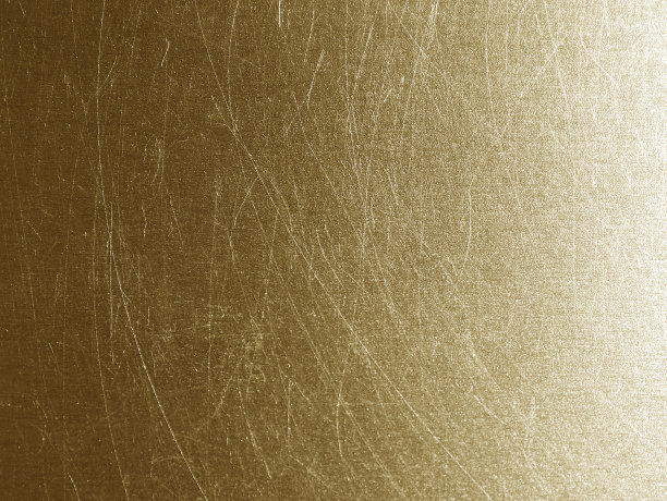 金属金色渐变背景与细划痕图片下载