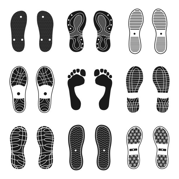 鞋足迹向量黑色剪影设置孤立的白色背景。图片下载