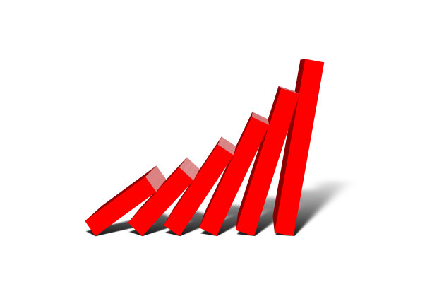 红色条形图倾斜的多米诺骨牌在业务风险的概念图片下载