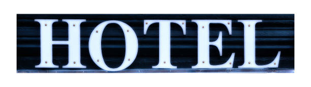 酒店作为明亮的字母在黑暗的背景上。图片下载
