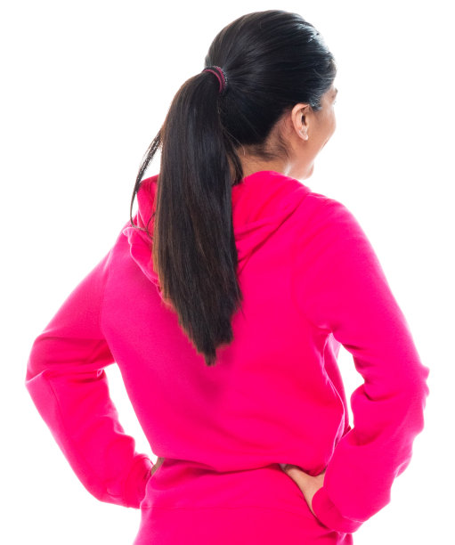 z一代年轻女性穿着裤子站在白色背景前图片下载