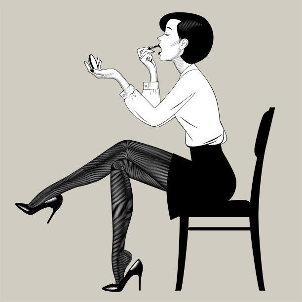 美丽的年轻女子涂她的嘴唇图片下载