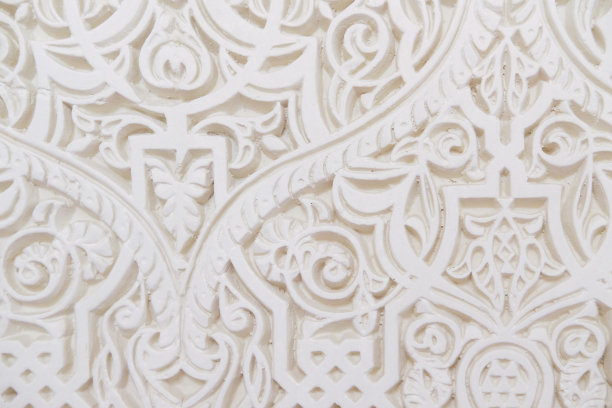 水泥白墙上手工雕刻的传统阿拉伯装饰品图片下载