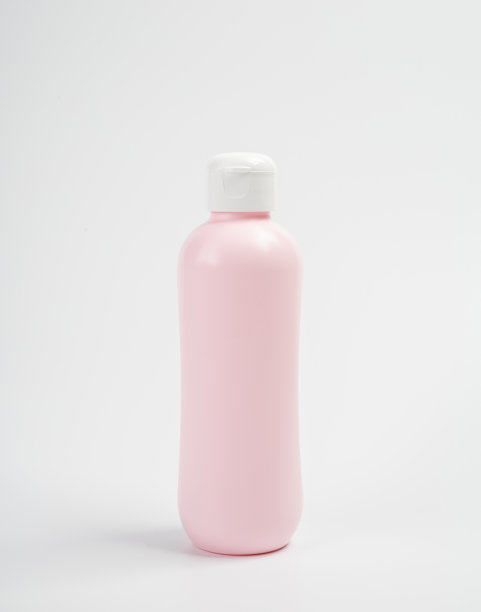 白色背景上的婴儿油或洗发水瓶子图片下载