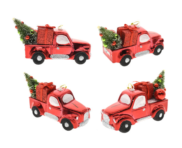 微型红色汽车载着杉树在白色的背景图片下载