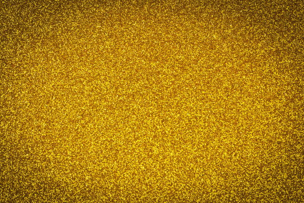 抽象的金色闪烁背景。闪烁的金色灯光圣诞背景图片下载