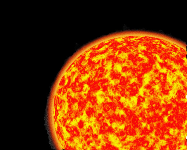 明亮的橙色和黄色的太阳近距离在黑色的背景图片下载