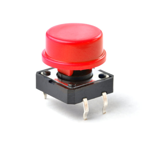 小型电子触觉拨动按钮开关与红帽隔离在白色背景。图片下载