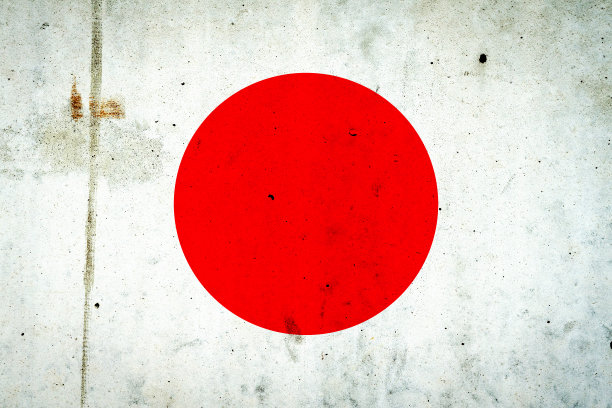混凝土墙上挂着日本国旗。旅行。图片下载