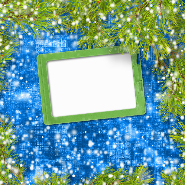 松树枝上抽象的绿色背景与雪花图片下载