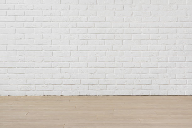 白色砖墙和复合地板的空房间图片下载
