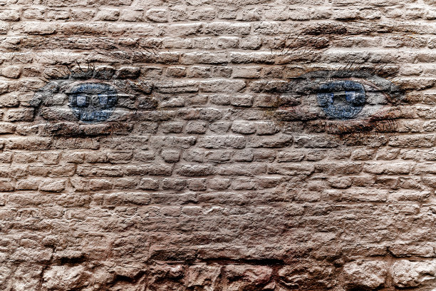 砖墙上女人的眼睛——涂鸦的样子图片下载