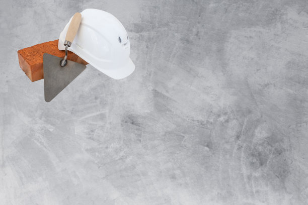 砌筑水泥砂浆工具。混凝土墙背景。copyspace、模板图片下载