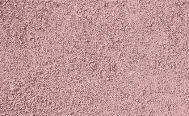 背景:深粉色芥末色混凝土墙面，彩色灰泥背景纹理图片下载