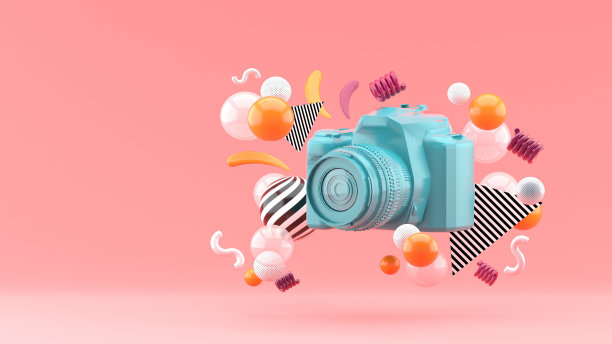 蓝色的相机被彩色的球围绕在粉红色的背景上。3 d渲染。图片下载