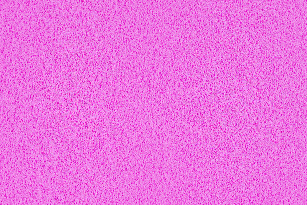 一张粉红色渐变的微距照片，纹理来自真正的泡沫海绵纸作为背景，背景或设计。图片下载