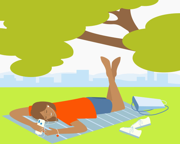 一个女孩躺在公园里听音乐图片下载