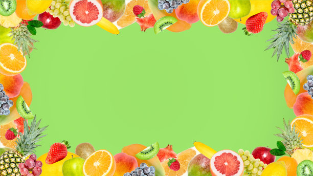 创意照片许多不同的异国情调的热带明亮的水果框架在夏季的绿色背景。从以上观点。明亮的夏季水果图案与复制空间。图片下载