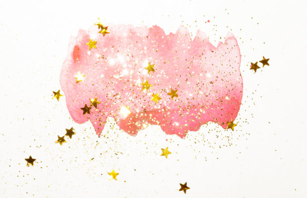金色的闪光和闪烁的星星在抽象的粉红色水彩喷溅在复古怀旧的颜色在浅灰色的背景图片下载