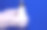 手拿一只白色手套与一个二极管放在蓝色的灯上。图片下载
