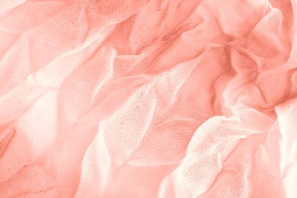 珊瑚褶皱织物的纹理。衣服的时髦颜色。特写镜头。图片下载