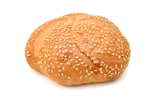 把面包和芝麻堆在白色的背景上图片下载