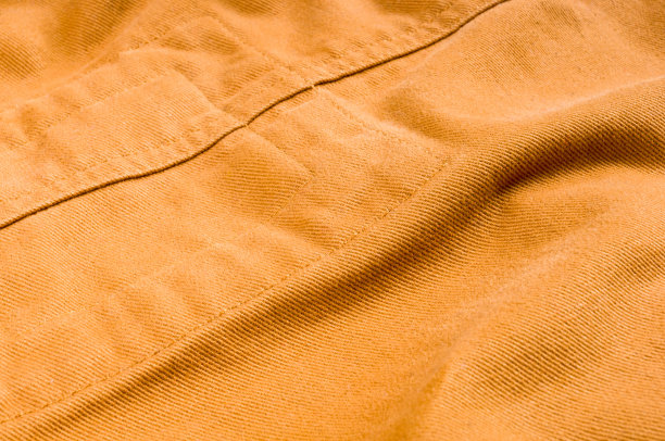 服装项目石洗棉织物纹理与接缝，扣，纽扣和铆钉，宏观图片下载