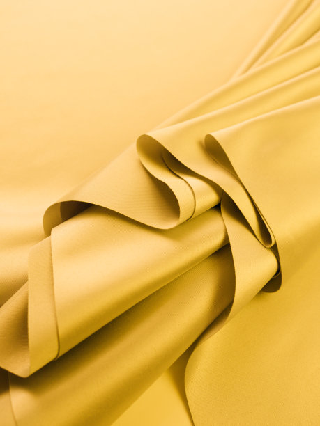美丽光滑优雅的淡黄波浪缎丝绸面料质地豪华图片下载