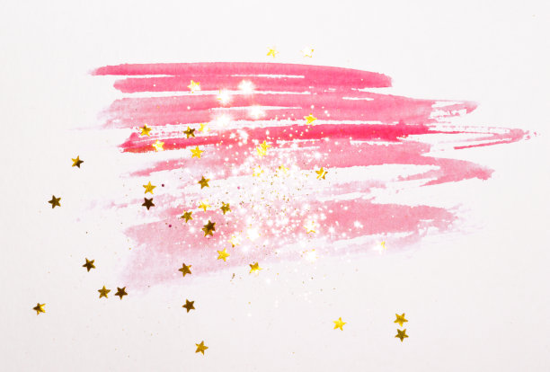 金色的闪光和闪烁的星星在抽象的粉红色水彩喷溅在复古怀旧的色彩图片下载