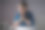 亚洲女人幸福在蓝色衬衫牵手祈祷，看着复印空间，工作在一个笔记本电脑在办公室。图片下载